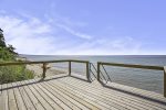 Private stairs down to the beach include a landing to rest and watch the Lake